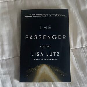 The Passenger by Lisa Lutz - Black Cover